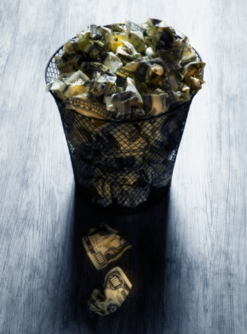 15.6.15 money in a garbage can